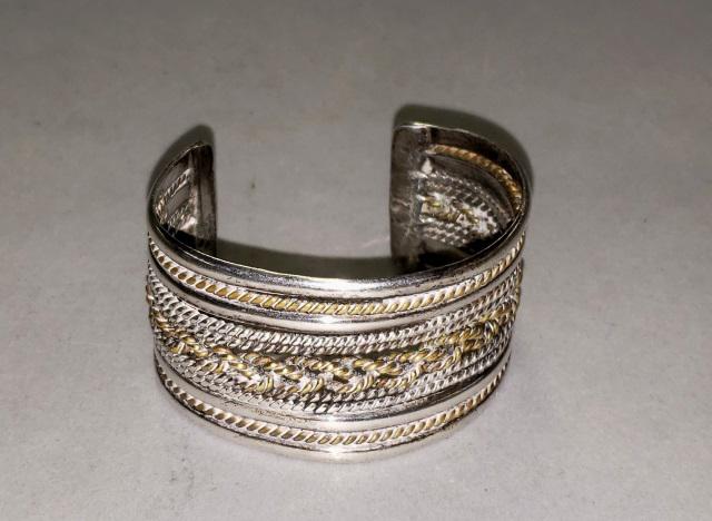 STERLING CUFF BRACELET: Sterling silver cuff bracelet, having beaded and woven design, marked 925 Mexico, approximate interior width 2 1/4", height 1 1/4", approximate total weight 1.87 ozt.