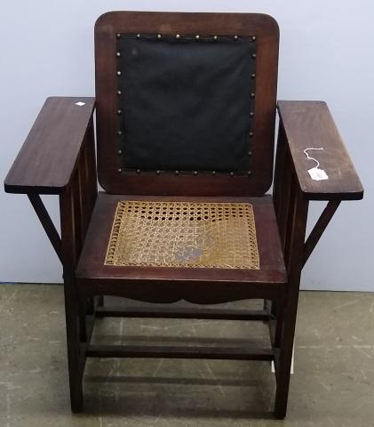 ARTS & CRAFTS STYLE ARMCHAIR: Having cane seat.
