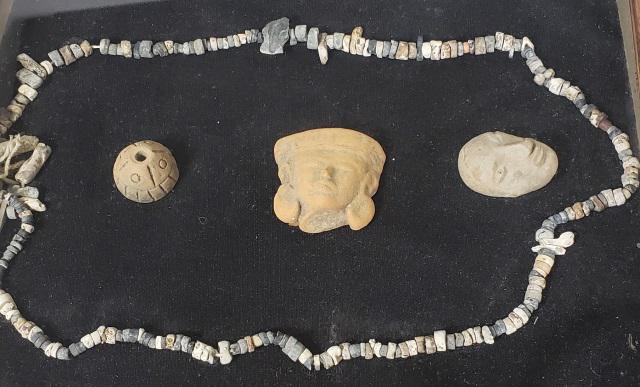 GROUP OF PRE-COLUMBIAN: Fragments, necklace, housed in a shadow box, 10" x 12".