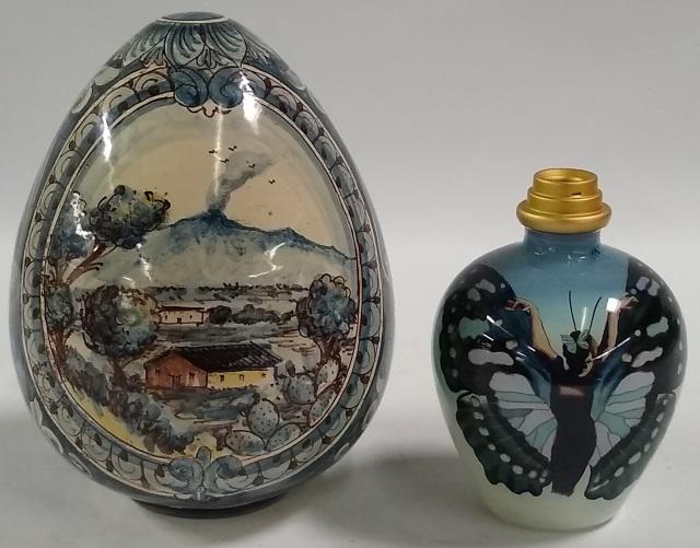 2 PIECES OF POTTERY: Shade, marked on interior "Sofia Cacta Girone made in Italy", decorated with rural landscape and leafy scrollwork, together with a glass dresser bottle, decorated with butterflies.