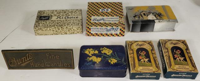 7 BUNTE CANDY ITEMS: Bunte desk plaque, 2 Jigsaw puzzles, "Butterscotch", "Mi Choice", "Colonial Chocolates" and "Honey, Butter Chocolate" tin.