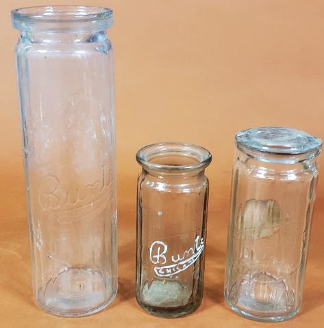 3 BUNTE CANDY JARS: 3 embossed Bunte Candy jars, one with lid and Bunte sticker, tallest is 7 1/2".