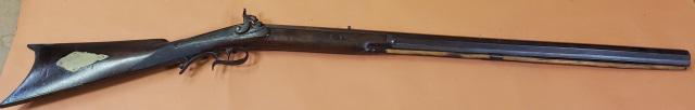 HAWKEN TYPE PLAINS RIFLE: Circa 1850, Rifle, Hawken type plains rifle, percussion, walnut of cherry half-stock with a pronounced comb, heavy octagonal barrel, brass escutcheon plate one side of stock, inlaid stags head on othe