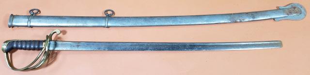 U.S. DRAGOON SABRE & SCABBARD: Circa 1835, U.S. Dragoon sabre and scabbard, model 1833, wooden grip, brass quillon, pommel, & open guard, top of quillon marked "WS" top of quillon marked "MPL", blade marked on left side, near base,