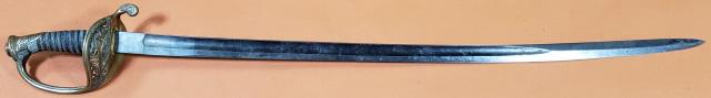 CIVIL WAR FIELD OFFICERS SWORD: Circa 1862, Civil War field officer's sword, model 1850, fish skin grip, wire wrapping, except for single twisted strand, is replacement, brass pommel, quillon, and guard, design of flowers and "US" o