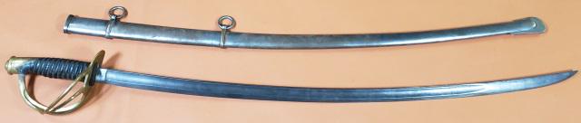 CIVIL WAR SABER & SCABBARD: Circa 1862, Saber & scabbard, Civil War, U.S. Cavalry sabre, model 1861, wooden grip wrapped w/leather, wire wrapping, brass quillon, pommel, & open guard, curved blade marked "US" over "CEW" over "18