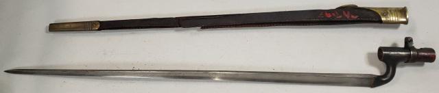CIVIL WAR BAYONET & SCABBARD: Circa 1862 Enfield bayonet and scabbard, Civil War era. Triangular socket bayonet. 27" leather scabbard with brass throat, tip. Deaccessioned from a Midwestern Museum.
