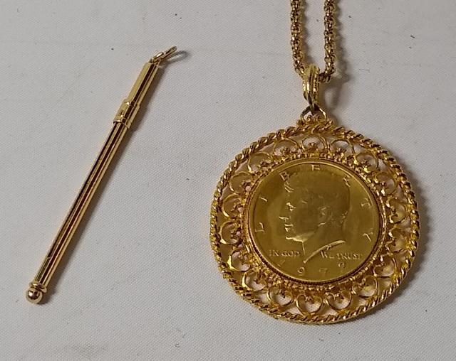 2 PIECES: 14KT gold pipe bowl cleaner and a 1972 gold colored Kennedy half dollar.