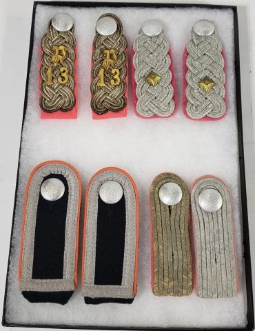 GROUP OF 8 WWII PANZER SHOULDER BOARDS: Housed in display.