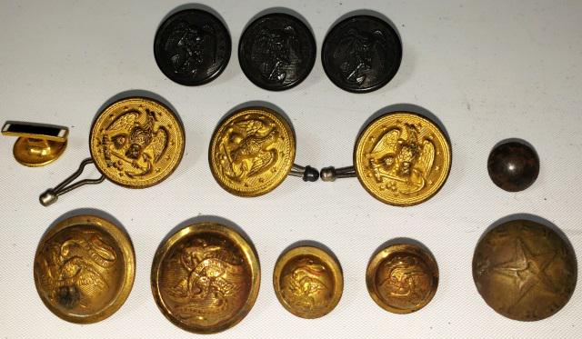 GROUP OF MISCELLANEOUS MILITARY BUTTONS: Circa 1812, Bullet button; 2 piece, traces of silver plating; 12mm; domed shape. Similar buttons found at War of 1812 sites in New York. Dragoon officers wore silver plated "bullet" buttons, also worn