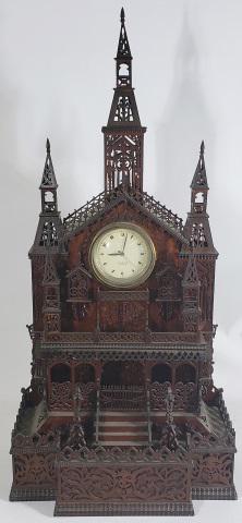 WOODEN CATHEDRAL CLOCK: With fretwork, approximate size height 39 3/4", width 18 3/4", depth 11", with electric clock marked "Hammond Junior". Deaccessioned from a Midwestern Museum.