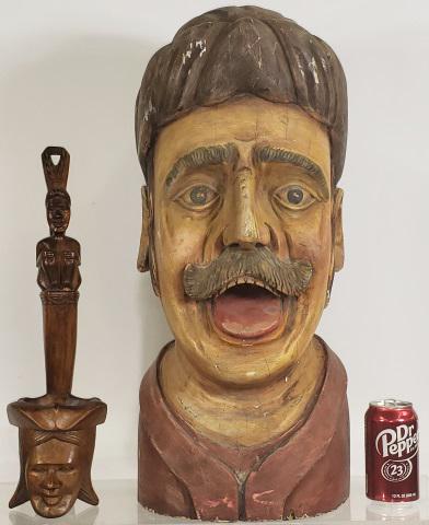 2 CARVED WOOD FIGURES: 1 depicting man, with handpainting, approximate height 25", and 1 Balinese style carving of figural ladle, height 18".