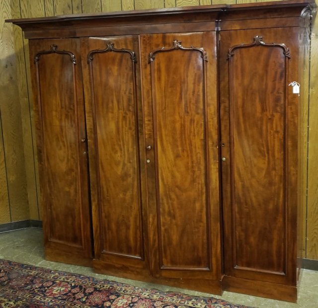 19TH C. MAHOGANY LINEN PRESS: Having double doors opening to shelves.