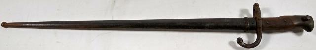FRENCH BAYONET: With wood handle, engraved illegibly, dated 1879.