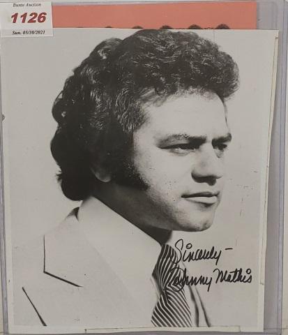 JOHNNY MATHIS AUTOGRAPHED PHOTO: Johnny Mathis black & white photo, autographed with black marker, Steve Fine Sports and Celebrity Memorabilia certificate of authenticity.