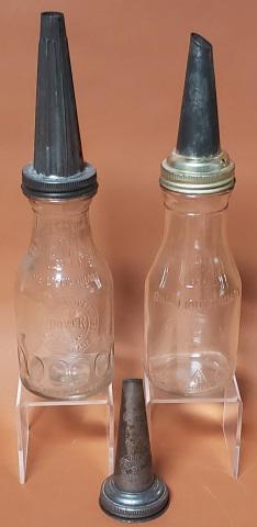 TWO VINTAGE GLASS MOTOR OIL BOTTLES: One marked Dover, No. 80, with fluted spout, another bottle marked 1 liquid quart, with spout, and an extra spout marked Bo. Rhodes.