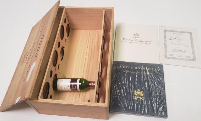 GROUP OF CHATEAU MOUTON ROTHSCHILD: Including 2000 crate, 1 empty bottle dated 1990, along with 2 books, Mouton Rothchild- Painting for the Labels.