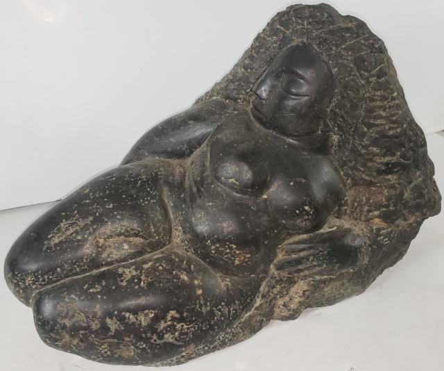 UNKNOWN ARTIST: Reclining nude woman, carved stone sculpture, indistinctly signed on side, approximate height 13 1/4", width 22", depth 12".