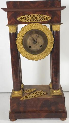 ANTIQUE FRENCH PILLAR CLOCK: Having ormolu mounts, constructed of wood and wood veneer, approximate height 20", width 10 1/2", depth 5 1/2".