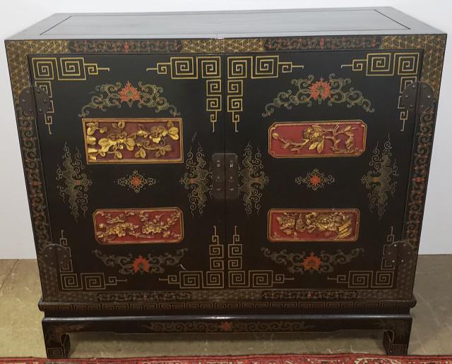 ORIENTAL STYLE CABINET ON STAND: Fitted with 2 doors, carved gilt panels depicting flora, exotic birds, etc.