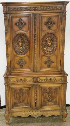 WALNUT ITALIAN RENAISSANCE STYLE RADIO CABINET: Upper section having flat molded cornice over single panel , decorated with mask and scroll work, over two doors with carved plaques depicting busts of Jacobean man & woman, opening to Zenith radio, l