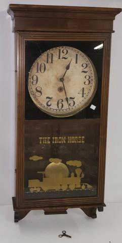 19TH C. WALL CLOCK: Fitted with time only movement, paper metal dial having Arabic numeral markers, enclosed in walnut case, lower panel designed with stencil "The iron horse", Steam engine, comes with pendulum, approxim