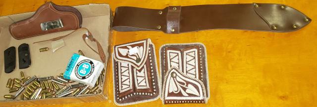 GROUP OF MISC. AMMO: Along with a holster, 2 matching decorative clip holsters, 2 Colt pistol grips and a leather knife sheath.