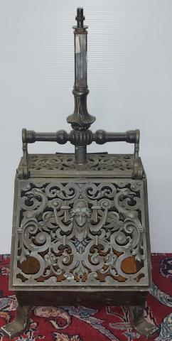 METAL COAL SCUTTLE BIN: Having hinged lid decorated with mask and mythical bird term figures, approximate height 26 1/2".