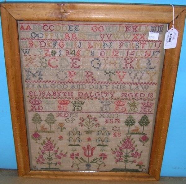 ***LATE 18TH CENTURY AMERICAN SAMPLER: By Elisabeth Dalgity, decorated with floral and tree designs and family Heraldy along with alphabet and numbers, undated, approximately 16 1/2'' x 12 1/2'', with frame 19 1/2'' x 15 1/2''.