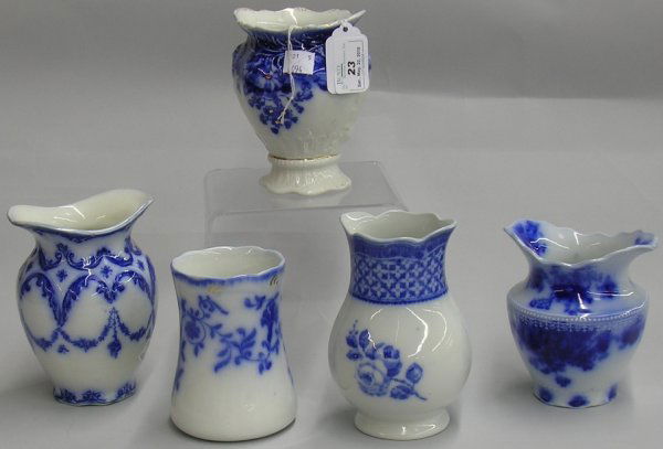 ***FIVE FLOW BLUE TOOTHBRUSH HOLDERS: Johnson Bros. ''Clayton'' pattern, Wood & Son ''Doris'' pattern, W.H. Grindley ''Albany'' pattern, Corona Ware ''Chantilly'' pattern and Hanley ''Colonial'' pattern, approximate height 4 1/2''-5 1/2''