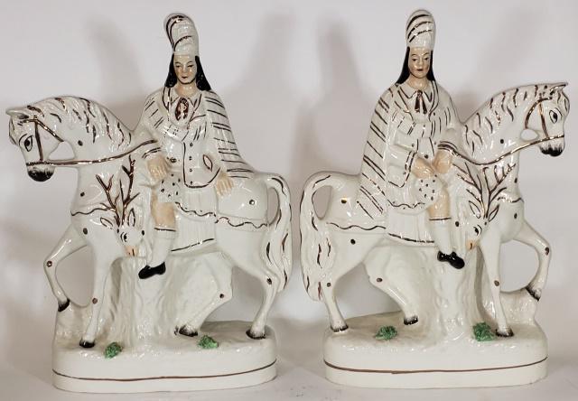 PAIR OF STAFFORDSHIRE FIGURES: Depicting Scottish hunters on horseback, each with stag, stamped on bottom, Old Staffordshire Ware England #93, approximate height 14 1/4".