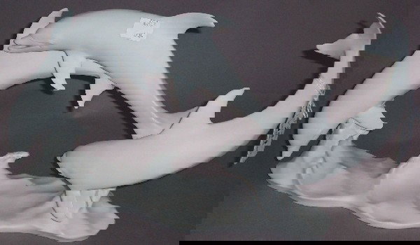 ***KAISER PORCELAIN FIGURAL GROUP: Leaping dolphins, approximate height 7 1/2''.
