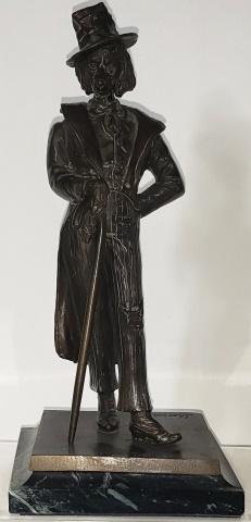 BRONZE SCULPTURE: Standing dog in suit, hat and holding cane, signed Sherman, approximate height 9 1/4".