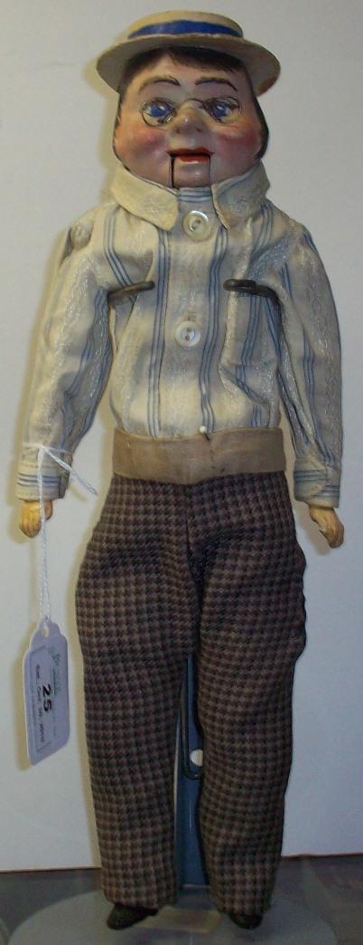 CHIN CHOPPER DOLL: Man with glasses, papier mache head with painted features, on composition body, comes from the estate of Geraldine (Jerrie) Kneipper, Kenosha, WI, member of ''The Badger State Doll Club'', approximate