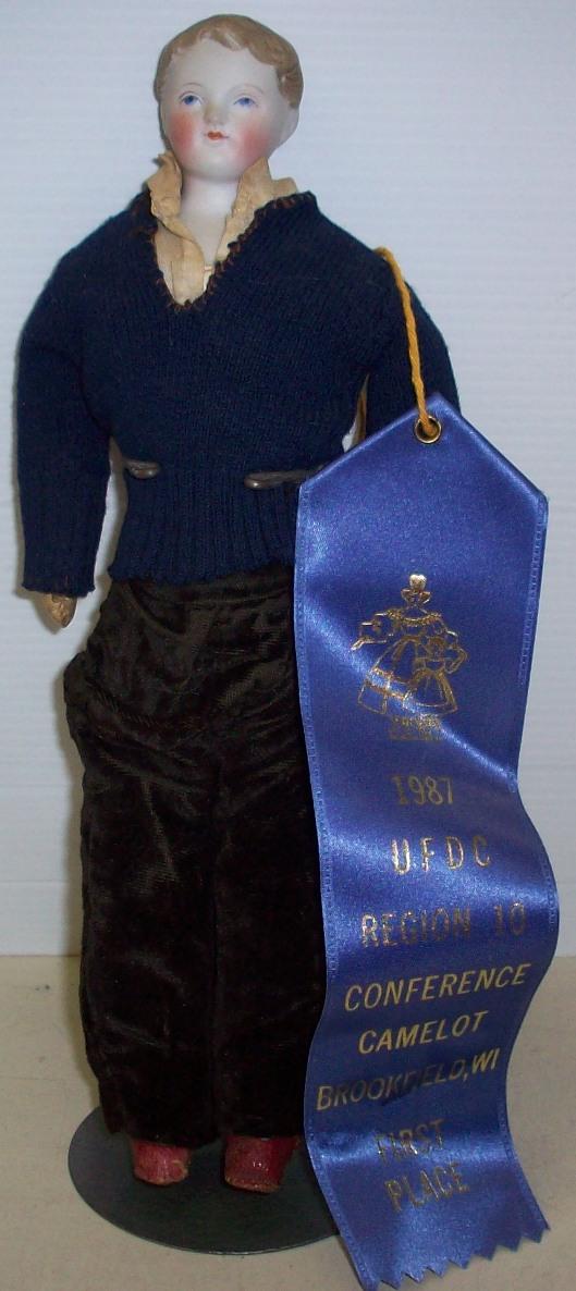 PARIAN HEAD BOY DOLL: Having blue eyes and brown hair, on leather body, 1st place ribbon from 1987, comes from the estate of Geraldine (Jerrie) Kneipper, Kenosha, WI, member of ''The Badger State Doll Club'', approximate h