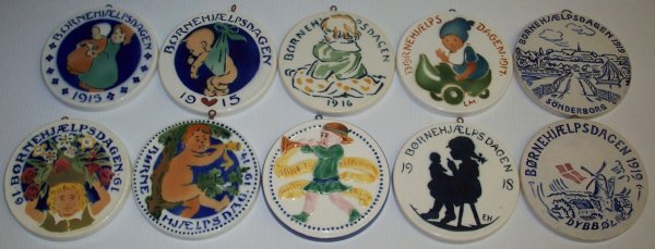 ***TEN ROYAL COPENHAGEN ALUMINIA FAIENCE CHILDREN'S AID: ***TEN ROYAL COPENHAGEN ALUMINIA FAIENCE CHILDREN'S AID DAY CHRISTMAS ORNAMENTS| 1912, 1914, two 1915, 1916, 1917, 1918, and three 1919. CONDITION: Crazing to underside. Estimate $20-2,000>