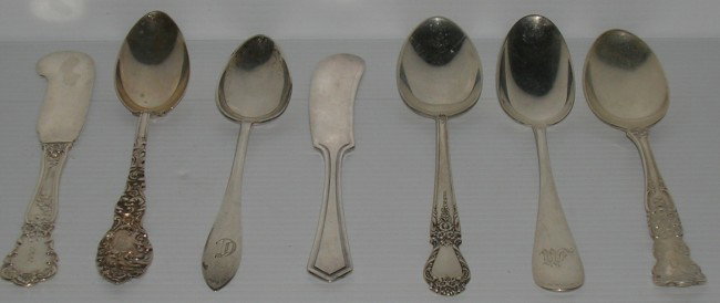 ***FIFTY-THREE PIECES OF AMERICAN STERLING SILVER: Various makers and patterns, comprising teaspoons and butter knives.