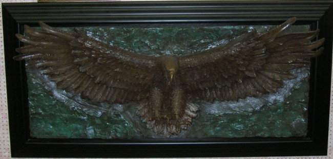 ***MACK, BILL: (Born 1949 American) ''Freedom'', composition bonded bronze sculpture, artist signed lower left, approximate sculpture size 27'' x 72'', contained in ebony wood frame, frame size 39 1/2'' x 79''.