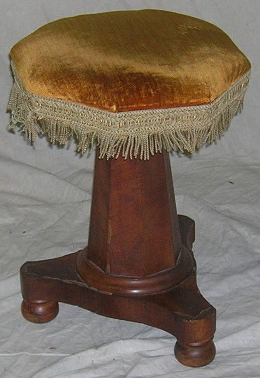 ***VICTORIAN ORGAN STOOL: Having gold upholstered seat, raised on pedestal base, approximate height 20''.
