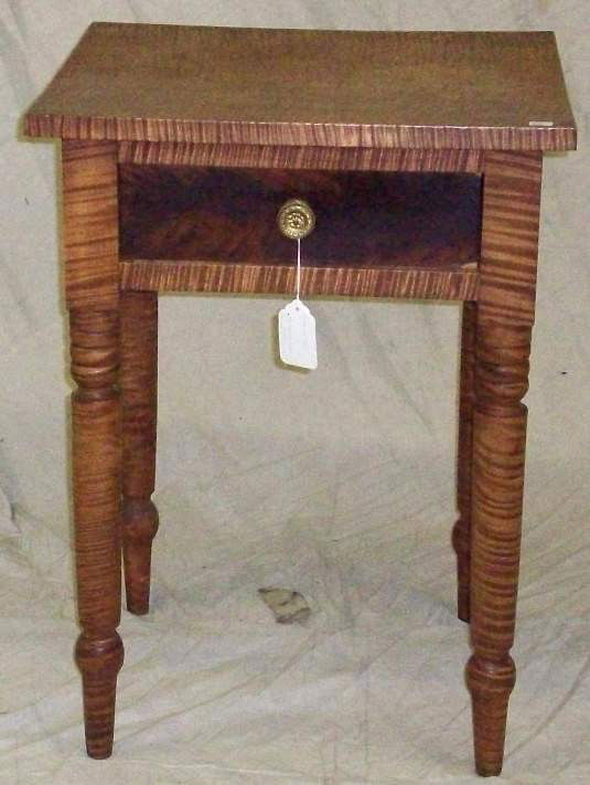 ***NINETEENTH CENTURY TIGER MAPLE WORK TABLE: Fitted with single drawer and raised on circular turned legs, approximate height 28 1/4'', width 20 1/4'', depth 17 1/2''.