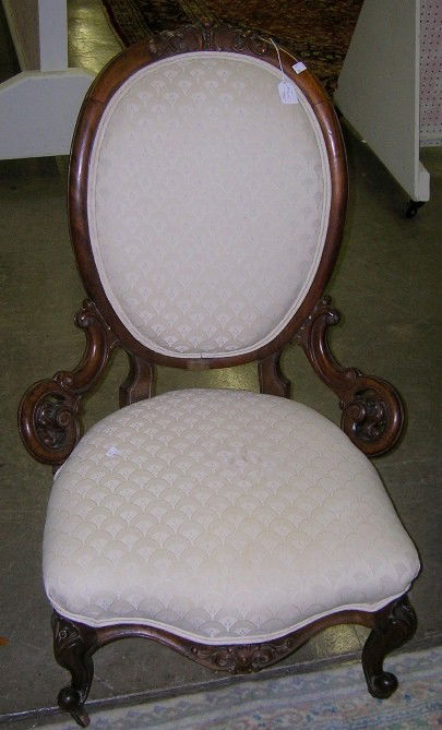 VICTORIAN LADY'S SIDE CHAIR: VICTORIAN LADY'S SIDE CHAIR| Having carved walnut frame and cream upholstered back and seat, approximate height 39 1/2", width 26", depth 29".