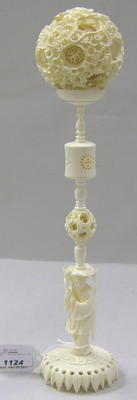 ***CHINESE CARVED IVORY PUZZLE BALL: Dragon form, raised on figural base, approximate overall height 14 1/2''. Note: Items containing ivory will only be shipped domestically.