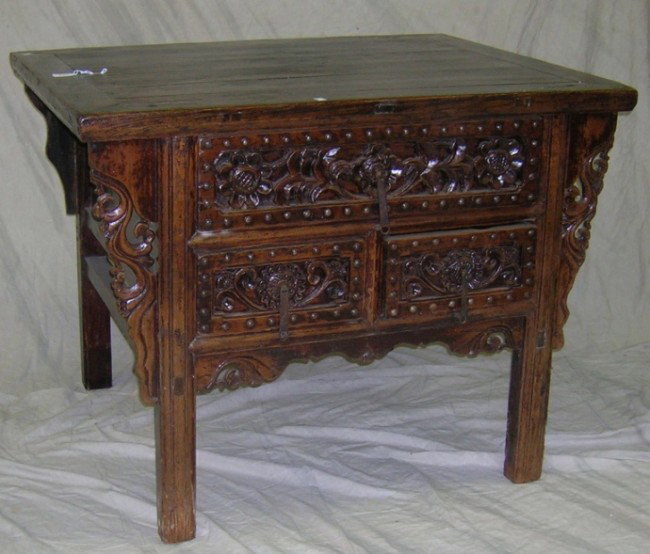 EIGHTEENTH CENTURY CHINESE NORTHERN ELM WOOD MONE: EIGHTEENTH CENTURY CHINESE NORTHERN ELM WOOD MONEY COFFER| Fitted with 3 drawers and raised on square legs, approximate height 34'', width 44'', depth 34 1/4''.