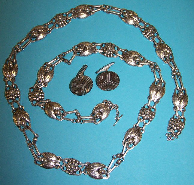 ***GEORG JENSEN .830 SILVER NECKLACE: Leaf and seed design, marked ''Georg Jensen .830 Denmark'', approximate length 32'', together with pair of Georg Jensen silver cuff links.