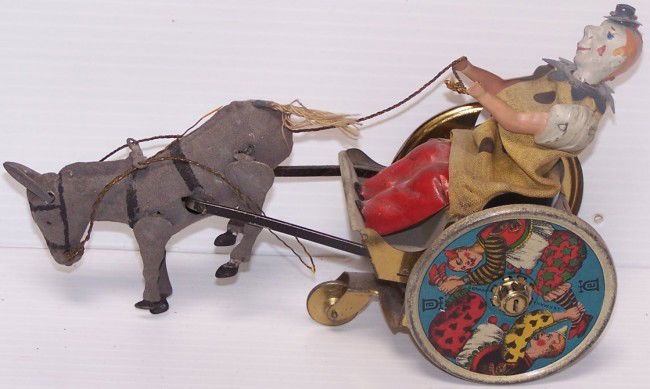 TIN WIND-UP TOY: ''Stubborn Donkey'', donkey pulling clown in cart marked ''Lehman Germany''.
