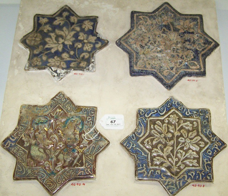 ***FOUR EARTHENWARE STAR TILES: Having luster and relief decoration set in composition block, approximate block size 19 5/8'', deaccessioned from Columbus Museum of Art.