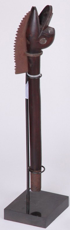 ***FIGURAL DUCK HEAD EDGED WEAPON: Wood and iron, approximate height with stand 20 1/4'', deaccessioned from Columbus Museum of Art.