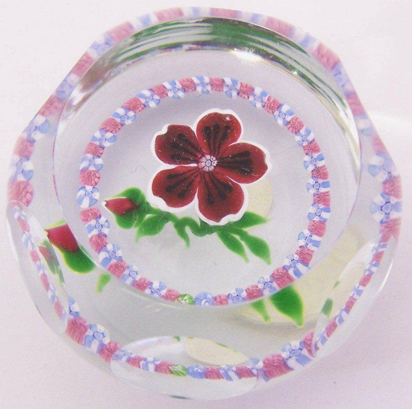 ***ART GLASS PAPERWEIGHT: In clear glass, having internal red floral and pink and blue millefiore decoration, internal initials ''AJ'', approximate height 1 1/2''.