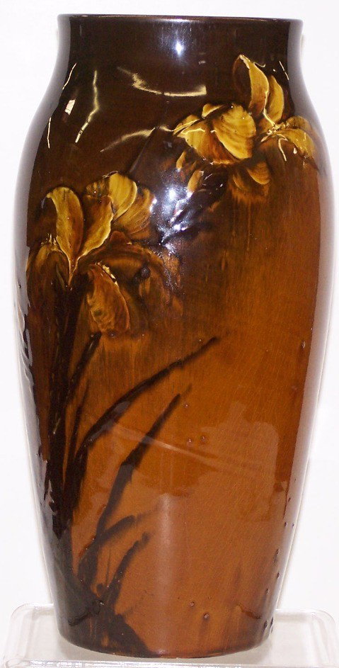 ROOKWOOD ART POTTERY VASE|: ROOKWOOD ART POTTERY VASE| Decorated by Matthew Daly, dated 1886, having brown tiger's eye glaze with floral and leaf decoration, approximate height 13 1/2".