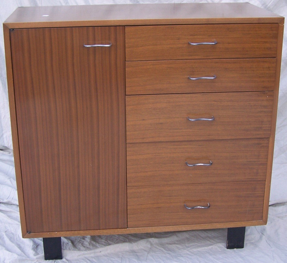 ***GEORGE NELSON/HERMAN MILLER CABINET #4621: Fitted with 5 drawers and single door, top drawer having applied metal manufacturer's label, approximate height 40'', width 40'', depth 18 1/2''.